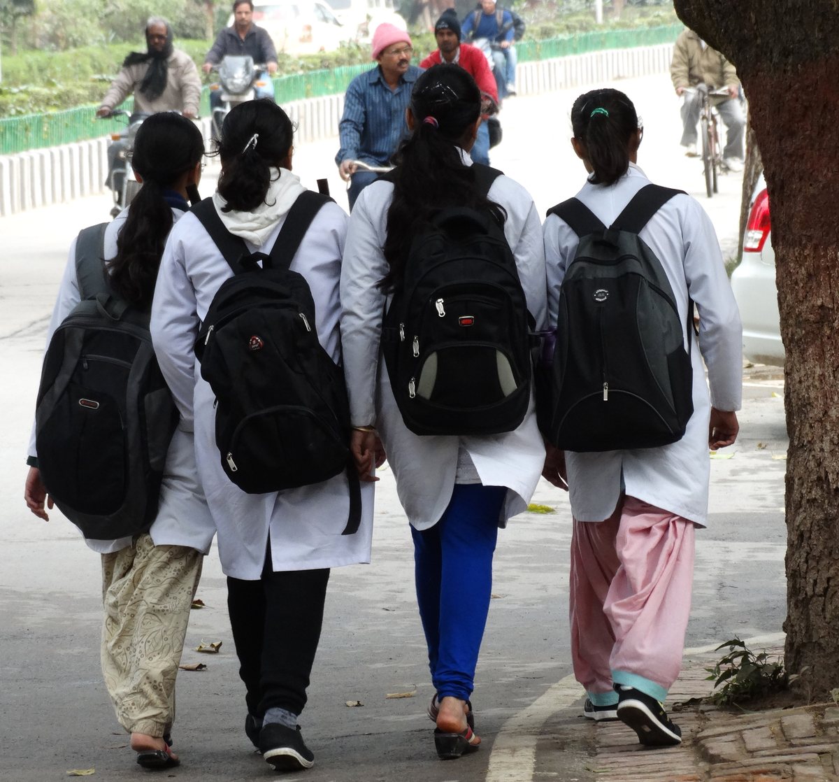 Women medical students walking together on campus